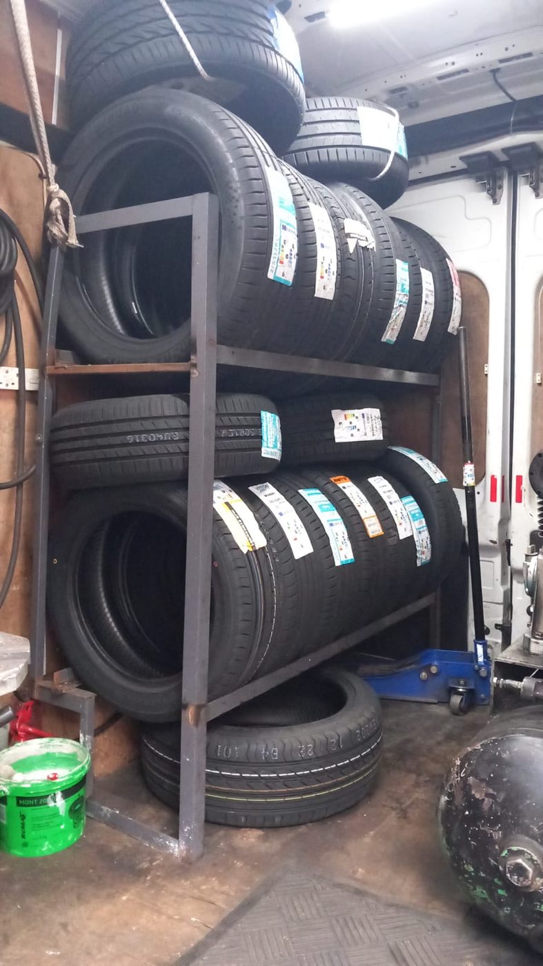 Fully stocked tyre rack inside the Rocco Mobile Tyres van