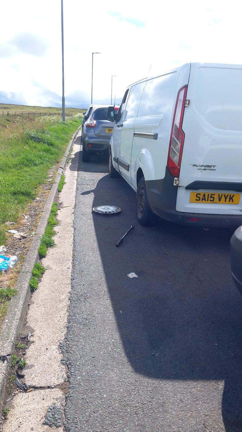 Roadside wheel change with the wheel removed